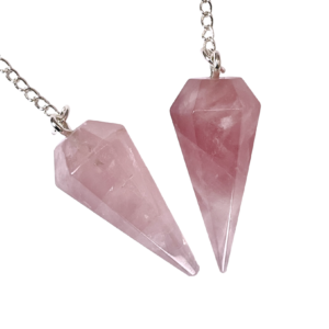 Example of two Rose Quartz Pendulums - pale pink stone - on a silver chain, on a white background