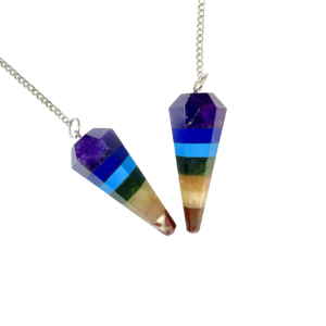 Example of two Chakra Pendulums - made from slabs of purple, dark blue, blue, green, yellow, orange and red - on a silver chain, on a white background