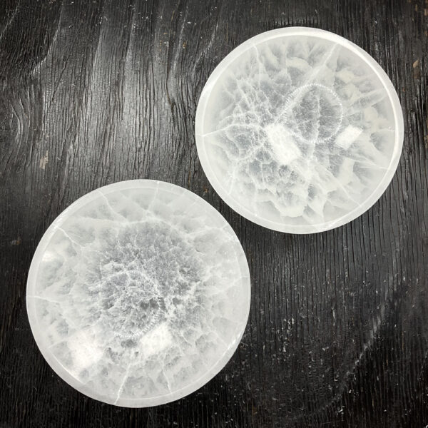 Two Round Bowl (Large) - Selenite from above - slightly translucent white bowls - on a dark wooden board