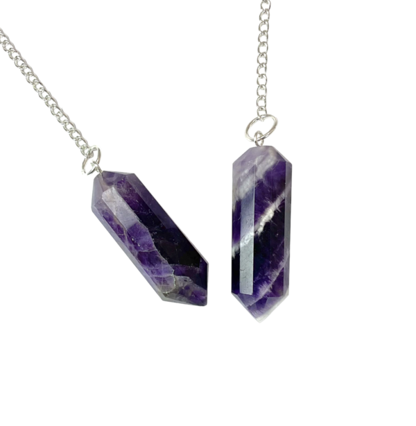 Example of two Amethyst DT Pendulums - purple stone carved into a two pointed rod - on a silver chain, on a white background