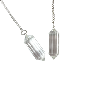 Example of two Crystal DT Pendulums - transparent stone carved into a two pointed rod - on a silver chain, on a white background