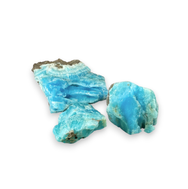 Three examples of Rough Aragonite (Blue) - teal, seafoam green, blue chunks of bright rock - on a white background.