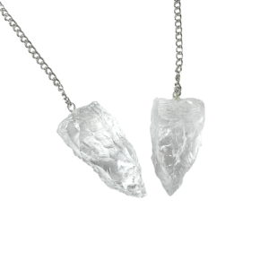 Example of two Quartz (Rough) Pendulums - transparent stone roughly carved into a point - on a silver chain, on a white background
