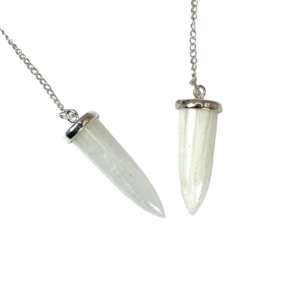 Example of two Scolecite Bullet Pendulums - white with cream striations in a bullet shape - on a silver chain, on a white background