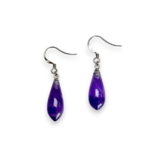 One pair of Amethyst Bowling Pin Drop Earrings - purple teardrop stones with sterling silver hooks - on a white background