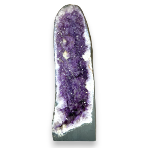 Amethyst Cave (7) shown from the front - half of a giant geode with purple points - on a white background