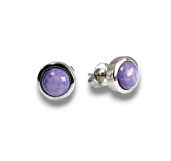 Pair of Charoite Round Sterling Silver Earrings - pale purple circular stone set into a silver fixing - on a white background