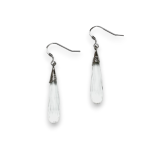 One pair of Quartz Faceted Pear Drop Earrings - elongated clear faceted teardrop stones with sterling silver hooks - on a white background