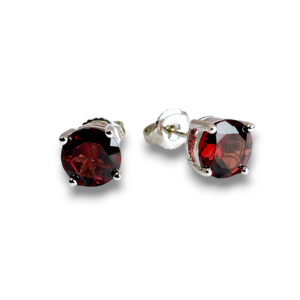 Pair of Garnet Stud Sterling Silver Earrings - transparent, faceted red stone set into a silver fixing - on a white background