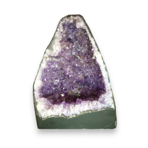 Amethyst Cave (12) shown from the front - half of a giant geode with purple points - on a white background