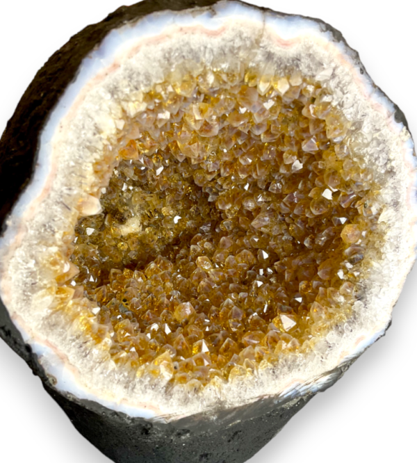 Citrine Cave (8) close up - half of a giant geode with orange points - on a white background