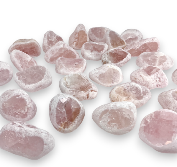 Group of Dragon Egg - Rose Quartz - pink partially tumbled stones, with a white, rough texture, and one polished face revealing the colour of the stone inside - on a white background