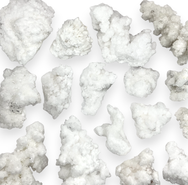 Large selection of Rough Aragonite (White) - pure white rock in coral like formations - on a white background.