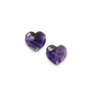 Two Amethyst Heart Side-Drilled side by side - purple stone with some white banding in a heart - on a white background