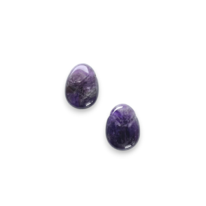 Two Amethyst Drop Side-Drilled side by side - purple stone with some white banding in an oval - on a white background