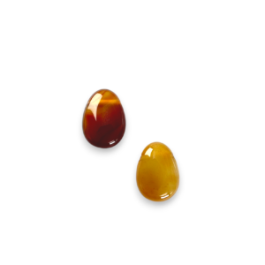 Two Carnelian Drop Side-Drilled side by side - orange and red stone - on a white background