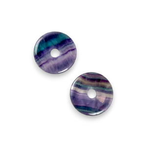 Two Fluorite 40mm Donut pendants - bands of white, blue, purple, green, yellow and clear - on a white background
