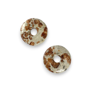 Two Garnet in Limestone 30mm Donut pendants - beige stone with some brown patches - on a white background