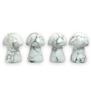 Four Howlite Mushrooms in a row - white with grey and black veining - on a white background