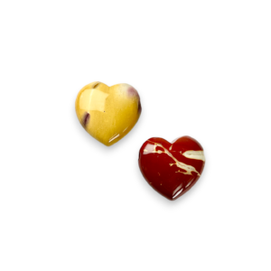 Two Mookaite Heart Side-Drilled side by side - one yellow with red banding and one red with yellow banding heart - on a white background