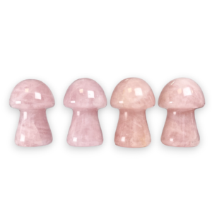 Four Rose Quartz Mushrooms in a row - pale pink stone - on a white background