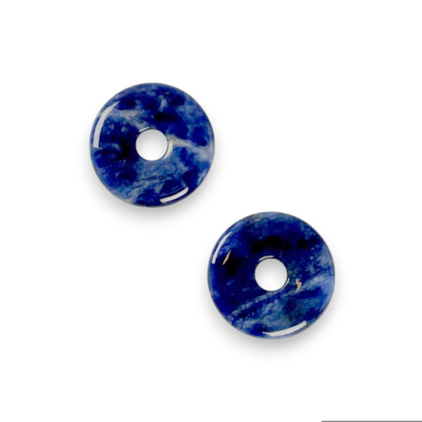 Two Sodalite Donut pendants - blue stone with white marbling - on a white background