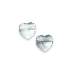 Two Crystal Heart Side-Drilled side by side - translucent stone with some inclusions - on a white background