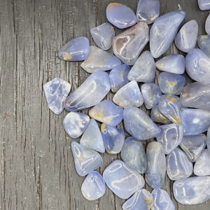 Example of Blue Chalcedony Dark L/XL A/A Grade tumble stone - classic baby blue with hints of light sandy yellow.