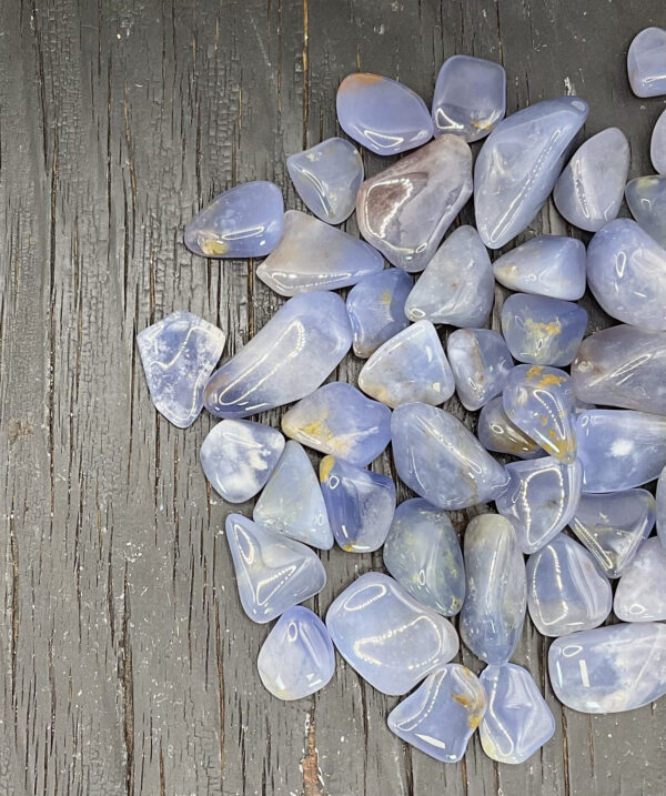 Example of Blue Chalcedony Dark L/XL A/A Grade tumble stone - classic baby blue with hints of light sandy yellow.