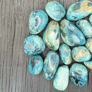 Example of Chrysocolla Peru AA Grade tumble stone - Beautiful shades of ocean blue with light dusty brown tones