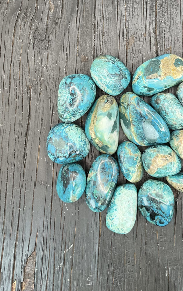 Example of Chrysocolla Peru AA Grade tumble stone - Beautiful shades of ocean blue with light dusty brown tones