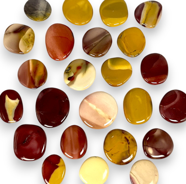 Group of Mookaite Pocket Stones - banded stones of red, yellow, purple, white - on a white background