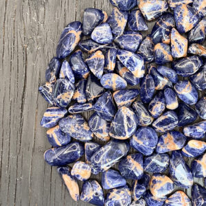 Example of Sunset Sodalite A Grade tumble stone - Beautiful shades of ocean blue mixed with soft brown tones