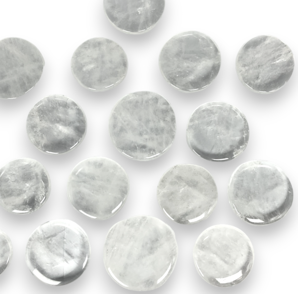 Group of Quartz Crystal Pocket Stones - clear stone with some inclusions - on a white background